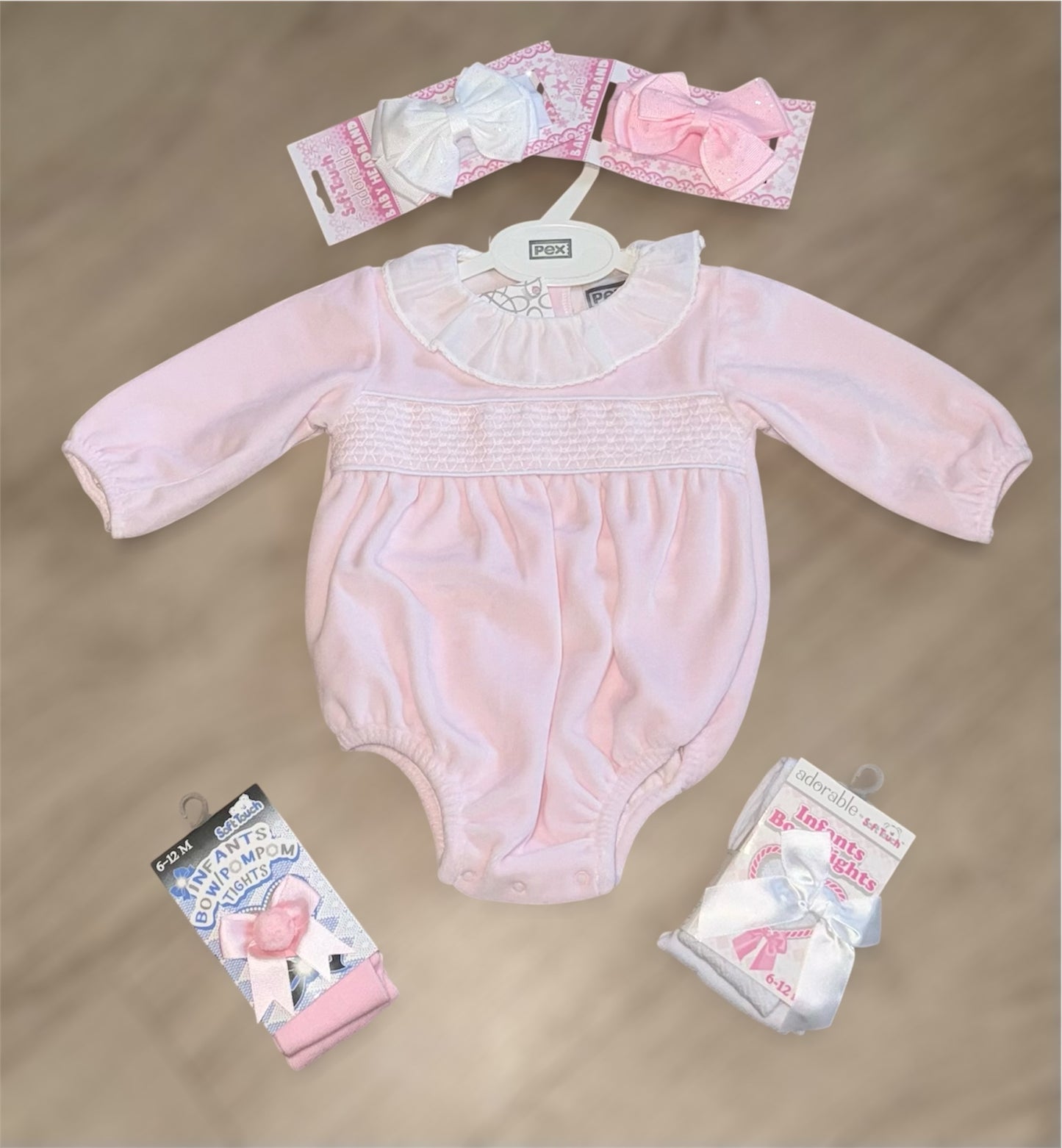 Pink velour smocked romper