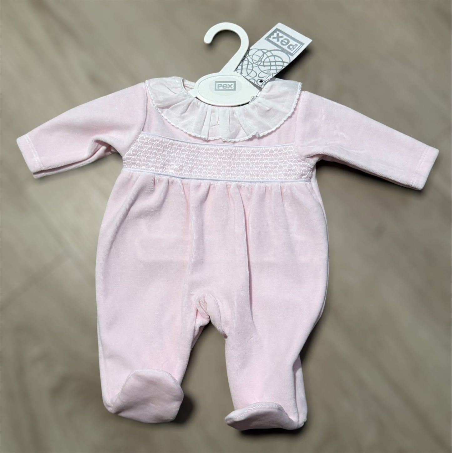 Baby girls pink smocked baby grow
