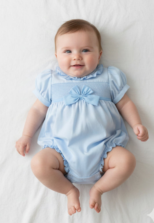 Baby girls blue smocked romper with bow