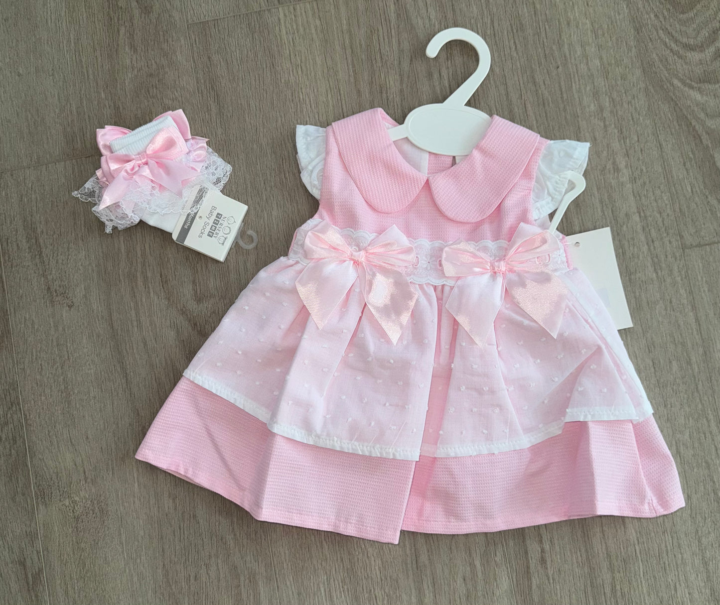 Baby girls pink bow dress